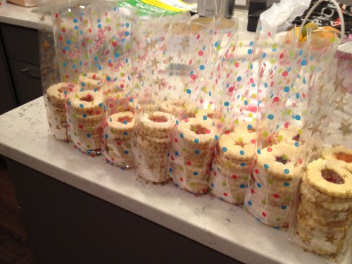 Each person who came to the cookie swap brought a baker's dozen dozen cookies... We then mixed and matched and each left with a dozen each of a dozen different kinds of cookies. Yum! These were Dani's sugar and jam delights... I made chocolate dipped macaroons.